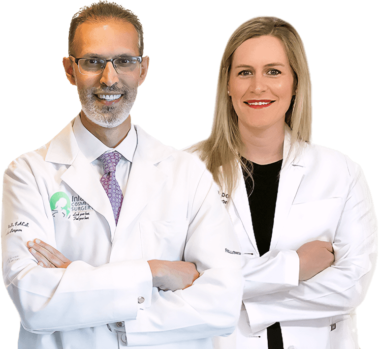 Portrait of Drs. Haiavy and Ryan standing wearing white surgical coats